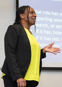 Woman teaching in front of a whiteboard