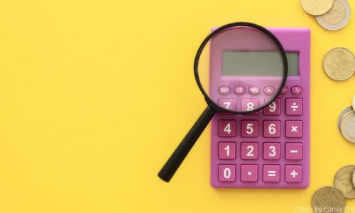 pink calculator with magnifying glass